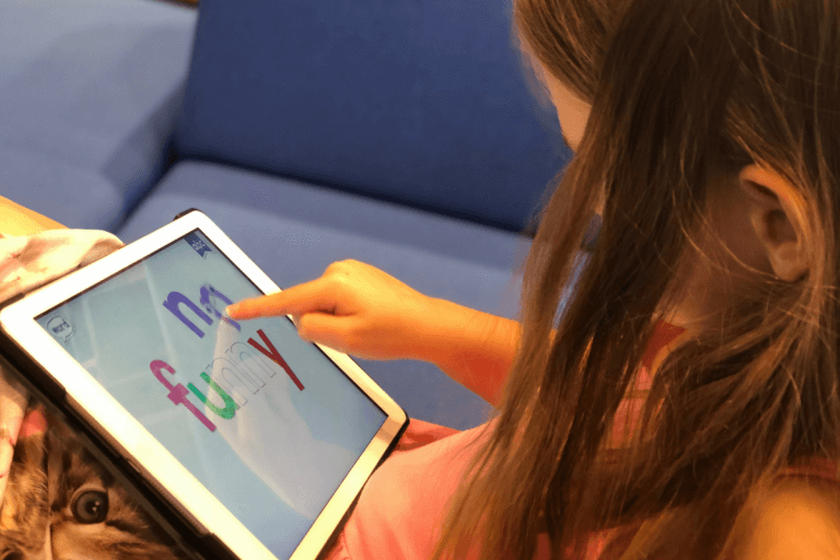 Child playing iPad