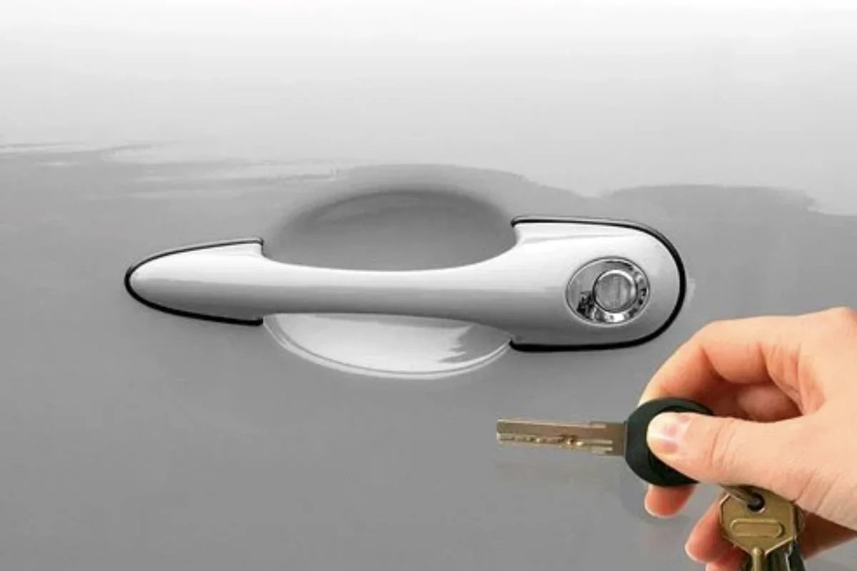 silver car with a key