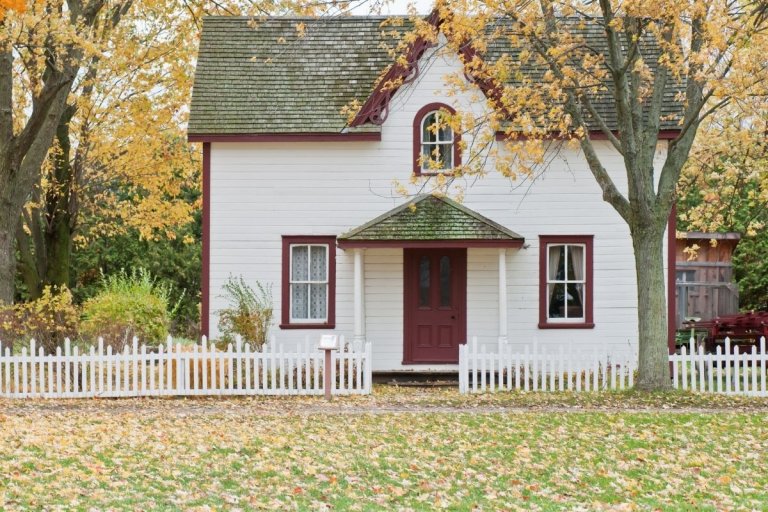 white house with grass outside