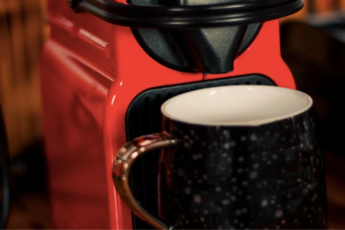 Red coffee maker with mug