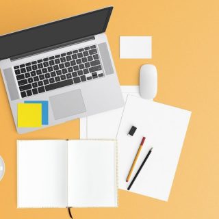 Orange background with a laptop