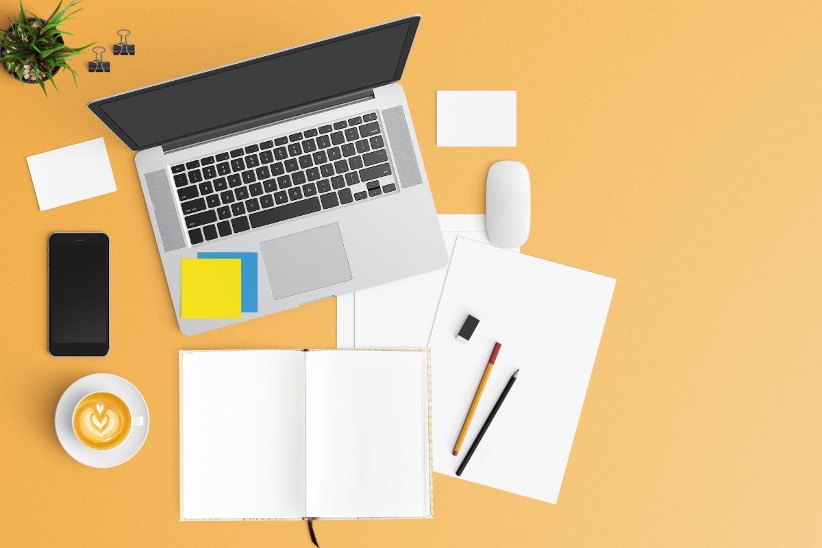 Orange background with a laptop