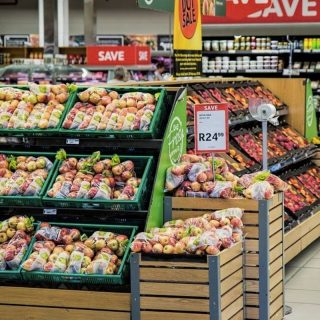 Supermarket shelf with fruit on