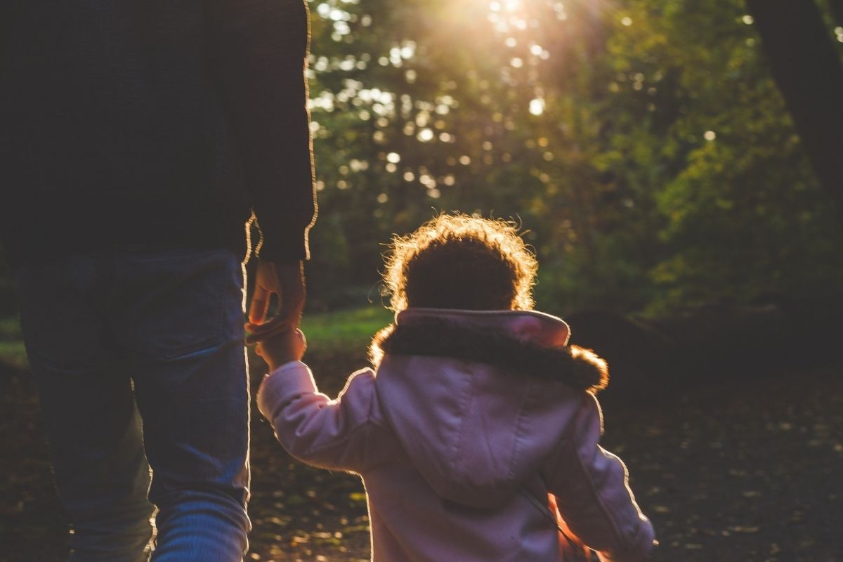 Child holding a parents hand