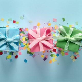 blue background with different colour boxed presents