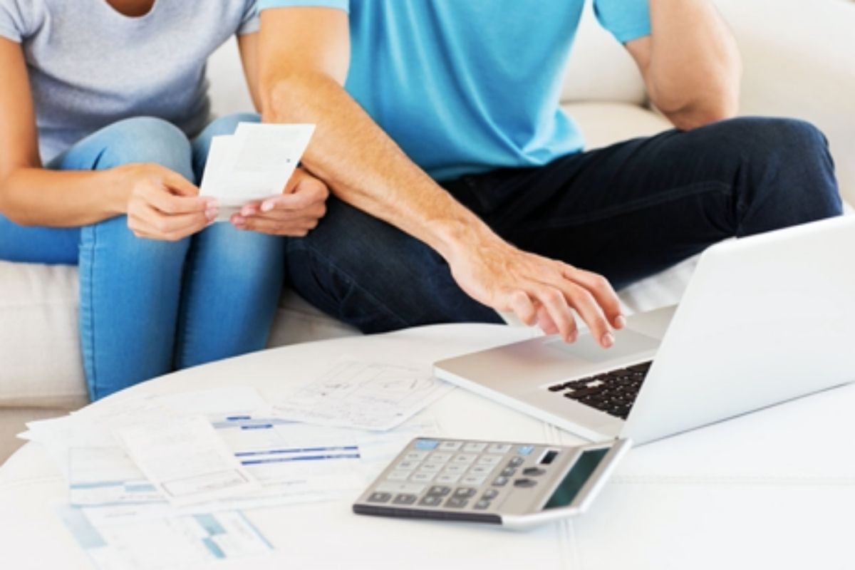 Two people sat looking at computer